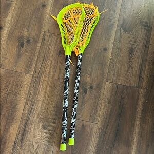 FLARE pair of Neon Green and Orange Lacrosse Sticks